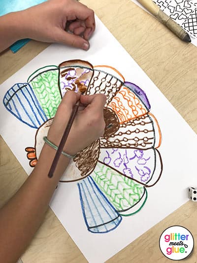 4th grade kid painting their thanksgiving turkey craft