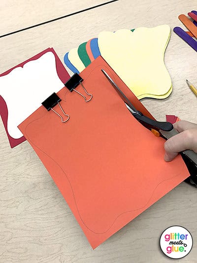 Use binder clips to hold paper together when cutting.