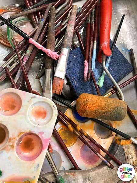 messy art supplies in the sink during cleanup time