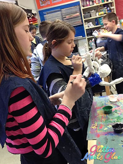 kids implementing the studio habits of mind during a sculpture art project